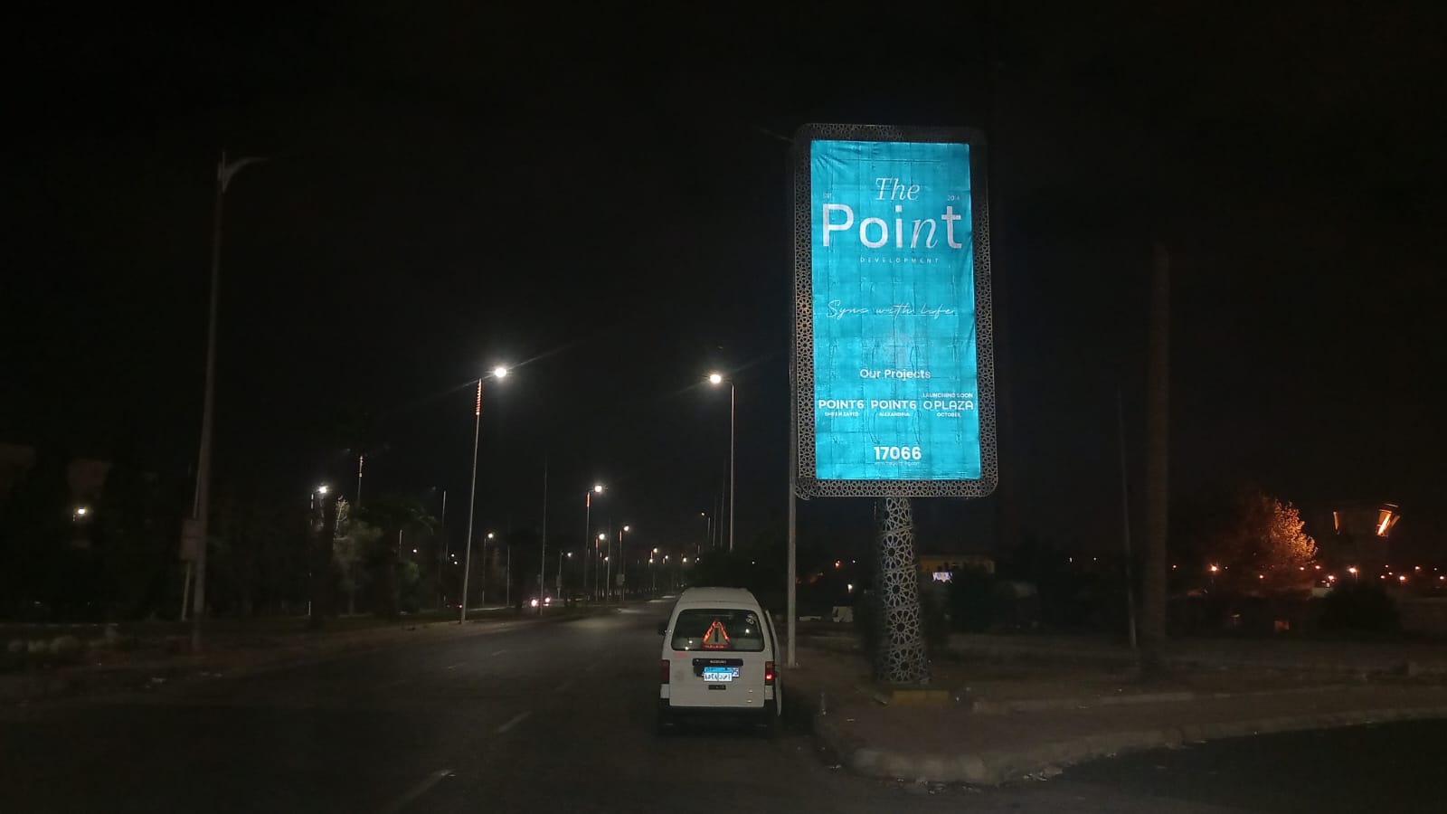 The Point illuminated unipole at night